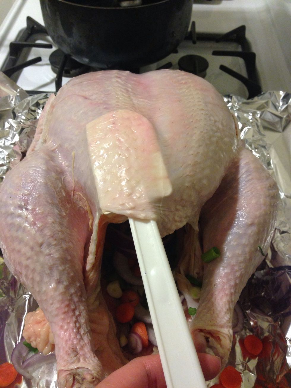 Use a spatula and separate all of the skin away from the breast meat. Make sure you don't puncture the skin.