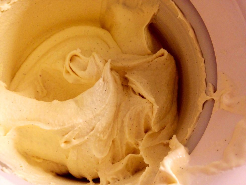 Use a spatula to get all the icecream from the machine to  the container. Just make sure it also fits the nuts, even though they aren't added straight away.