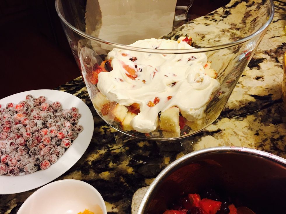 Use a spatula to get whipped cream spread into the cracks. The trick to a great trifle is the balance between soggy pound cake & dry pound cake. You want just enough but not too much flavor.