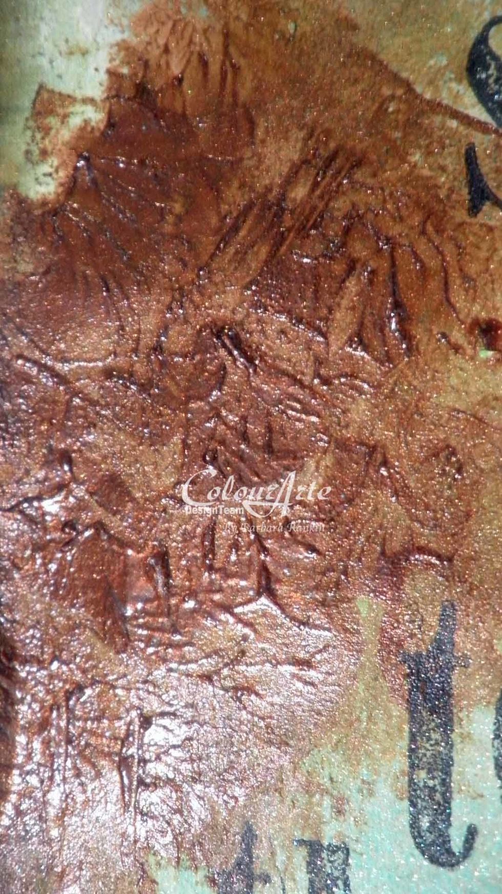 Use a spatula to spread Indian Copper Radiant Gel dimensional paint in three spots on the page. Pat the spatula over the paint to give it a texture, almost like a crackle effect.