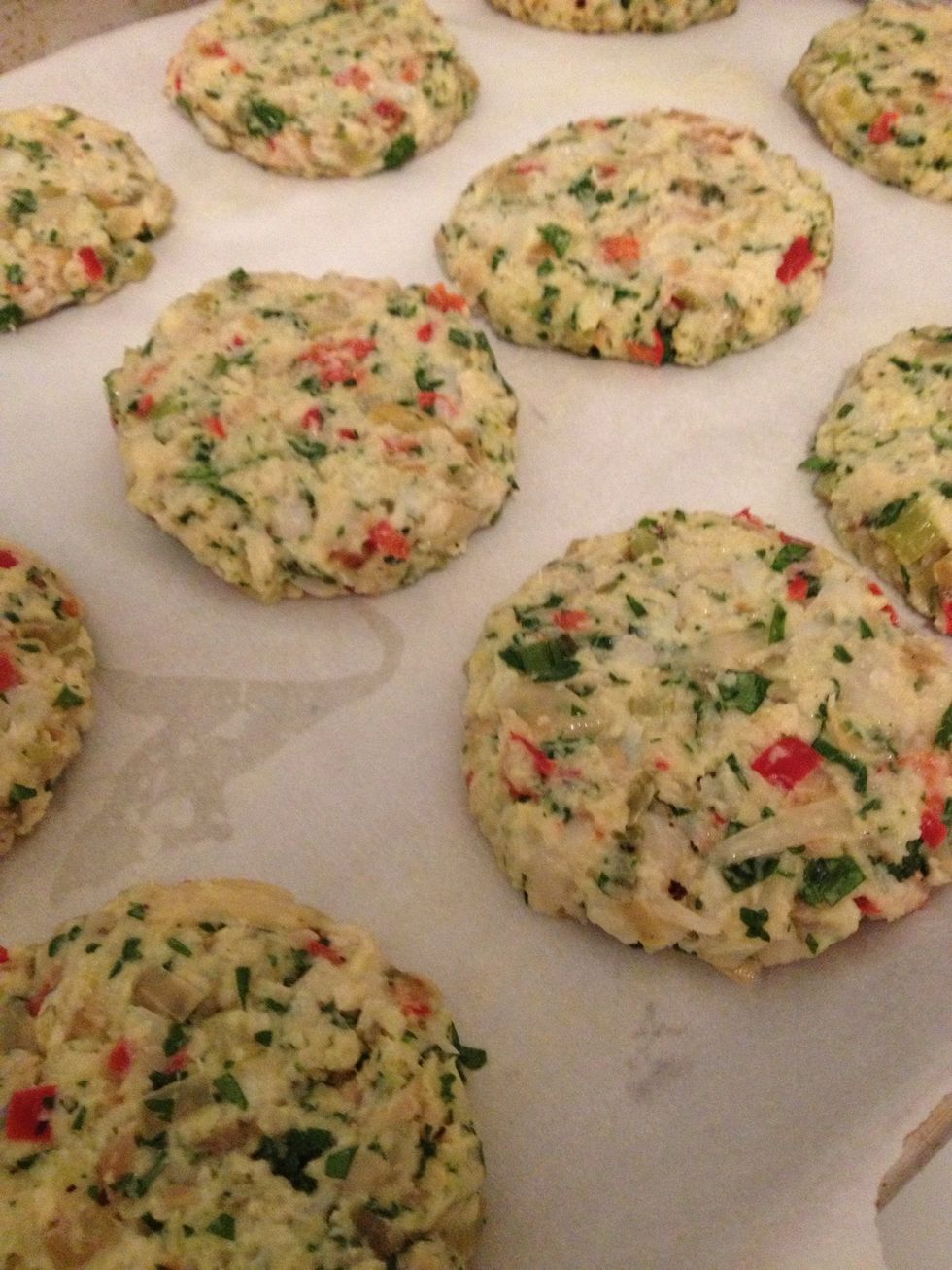 Use a spoon to scoop out the mix and form similarly sized patties.  Place patties on a parchment paper-lined baking sheet sprayed with some cooking spray.