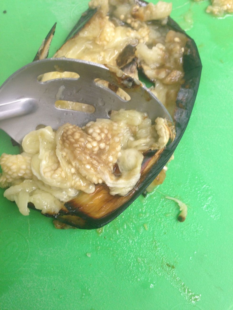 Use a spoon to scoop the eggplant flesh out.