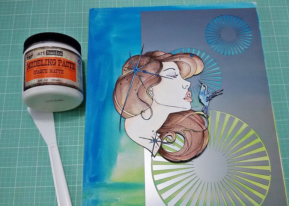 Use a stencil and modeling paste to create texture and effect on your canvas.