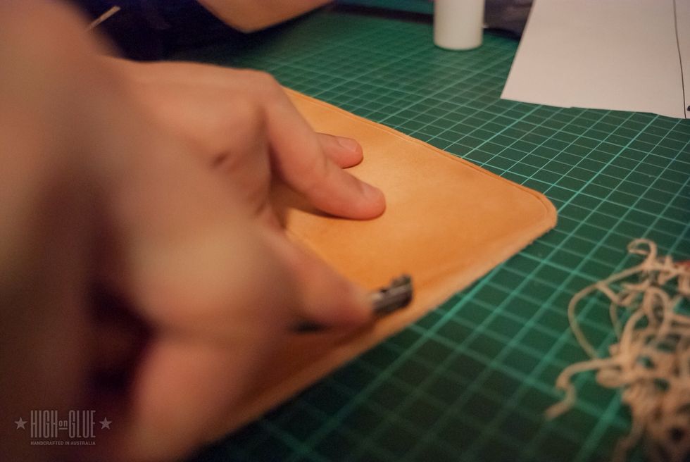 Use a stitch spacer (a tool with a "spiky" wheel) to make the markings for your stitches. This will help you to create even and nice looking stitches later on.