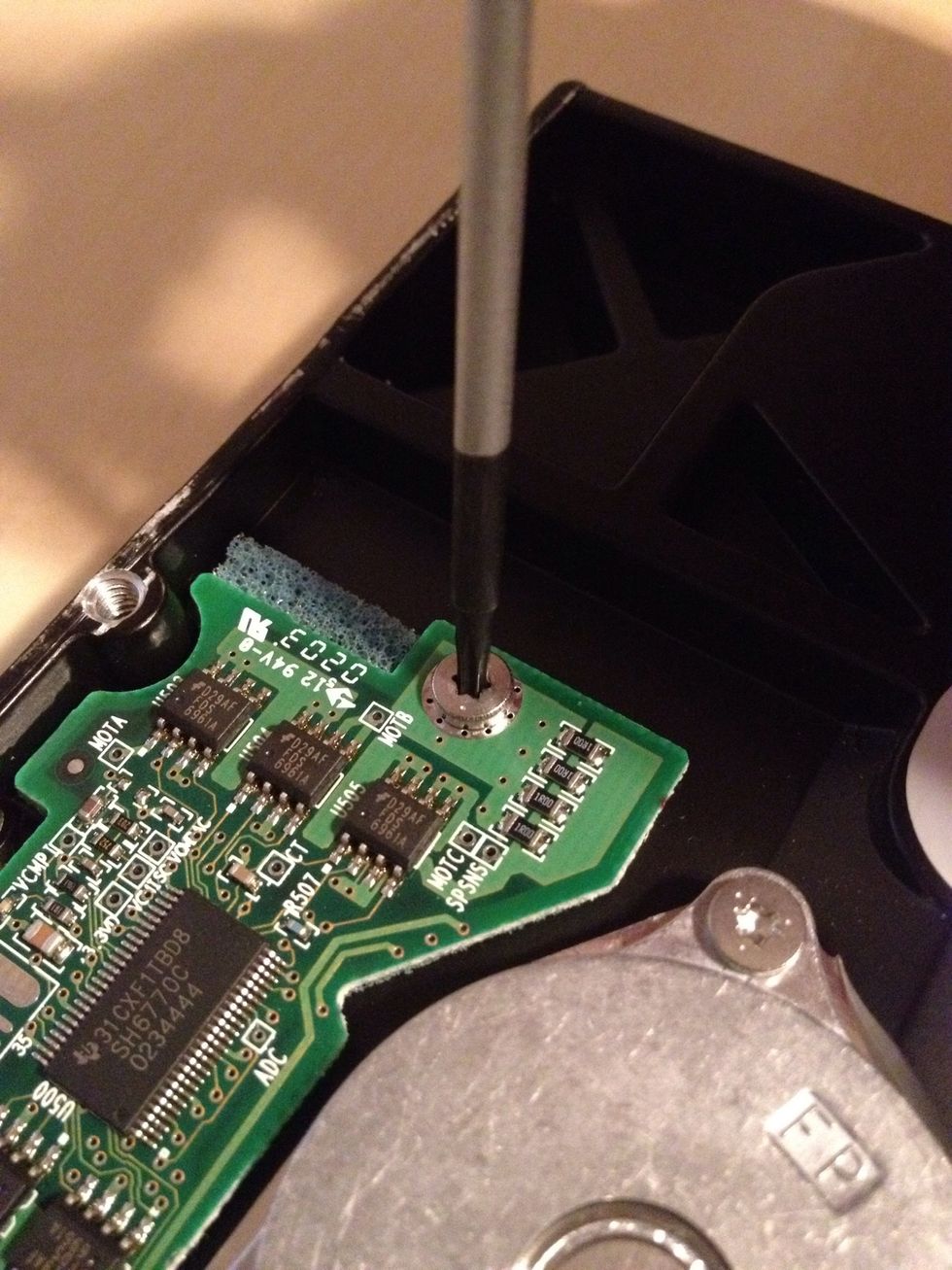 Use a T7 screwdriver to remove as many screws as you can access. You'll probably be able to remove the main circuit board from the enclosure.