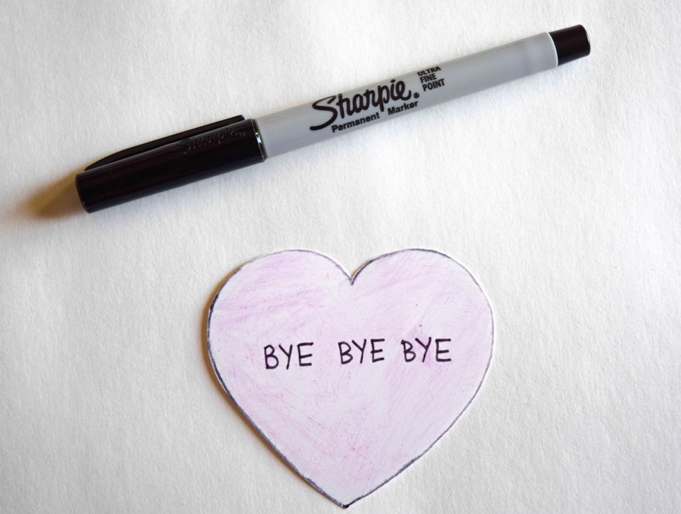 Use a thin black Sharpie to add desired love song titles or lyrics to your heart.
