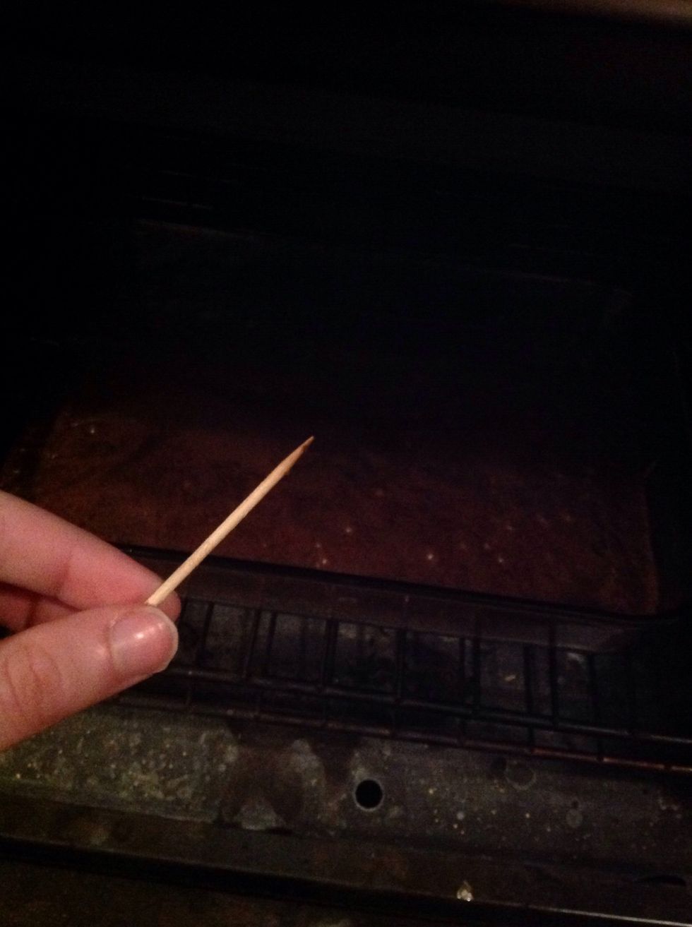 Use a tooth pick and poke the middle all the way down to the pyrex. CAREFUL ITS HOT. Tooth pick should come out clean.