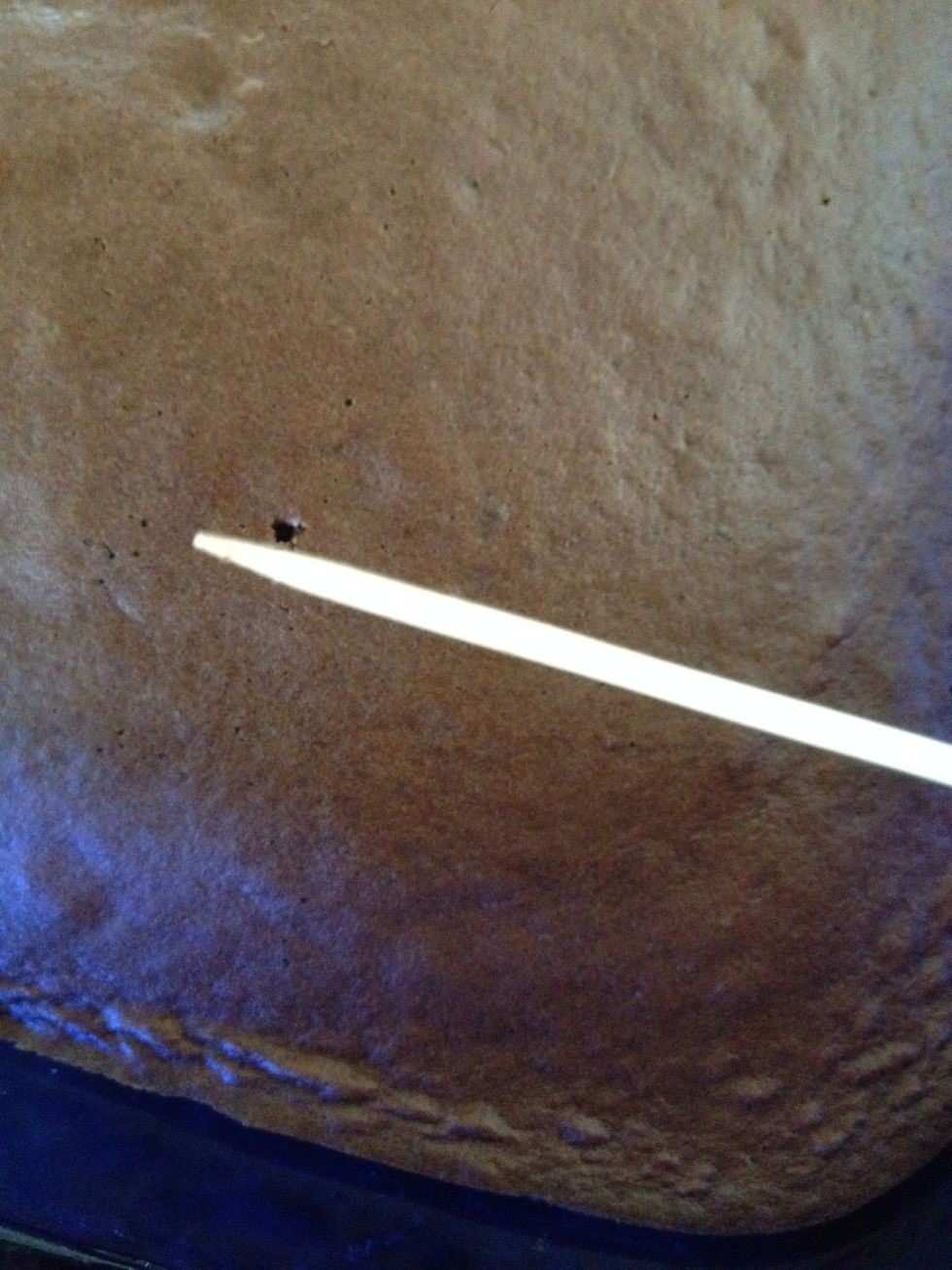 Use a toothpick and poke the cake to see if it is done. If the cake sticks to the toothpick, bake the cake for a few more minutes until the toothpick comes out clean