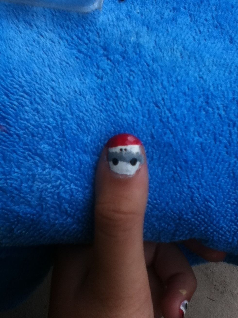 Use a toothpick or small dotting tool to create nostrils in the white portion.