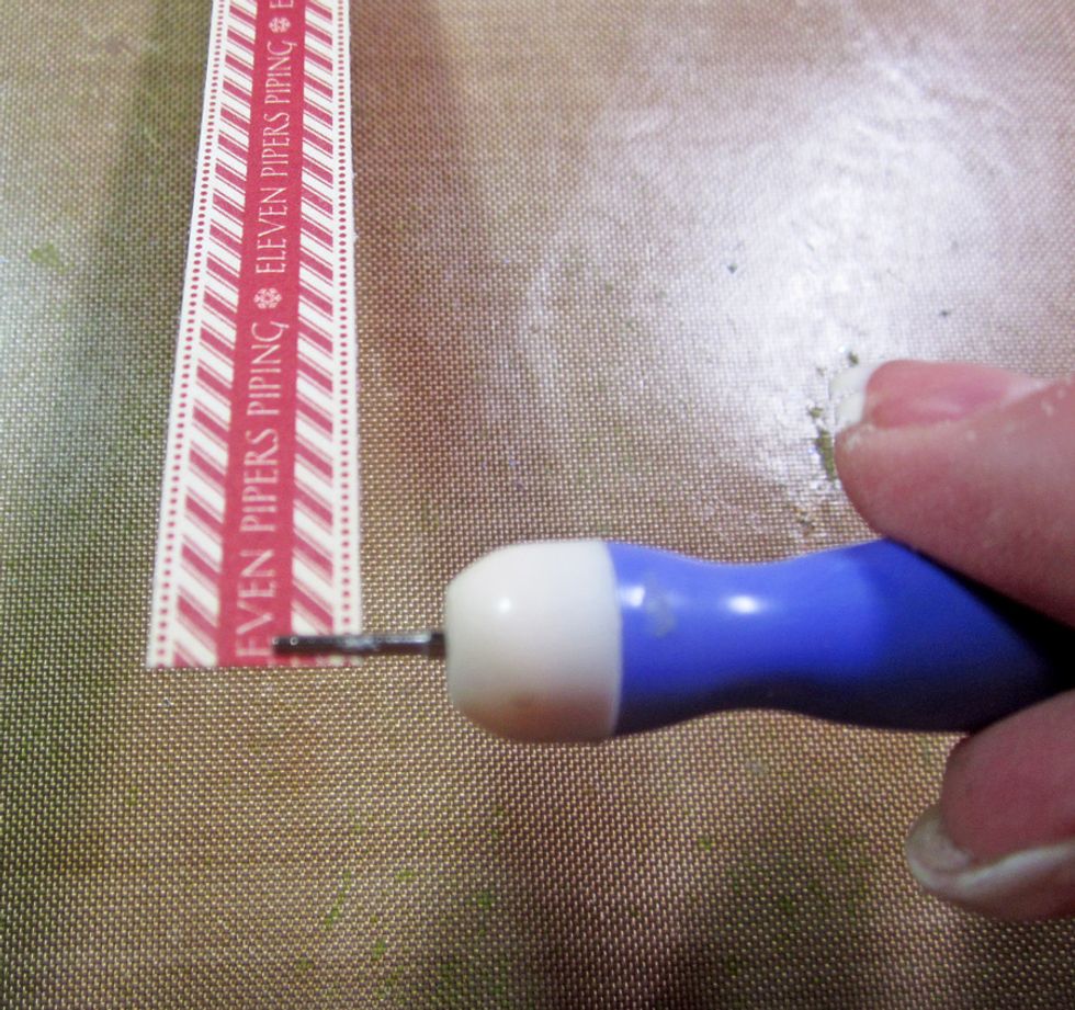 Use a twilling tool and thread the end of the paper strip onto the tool and begin to roll.