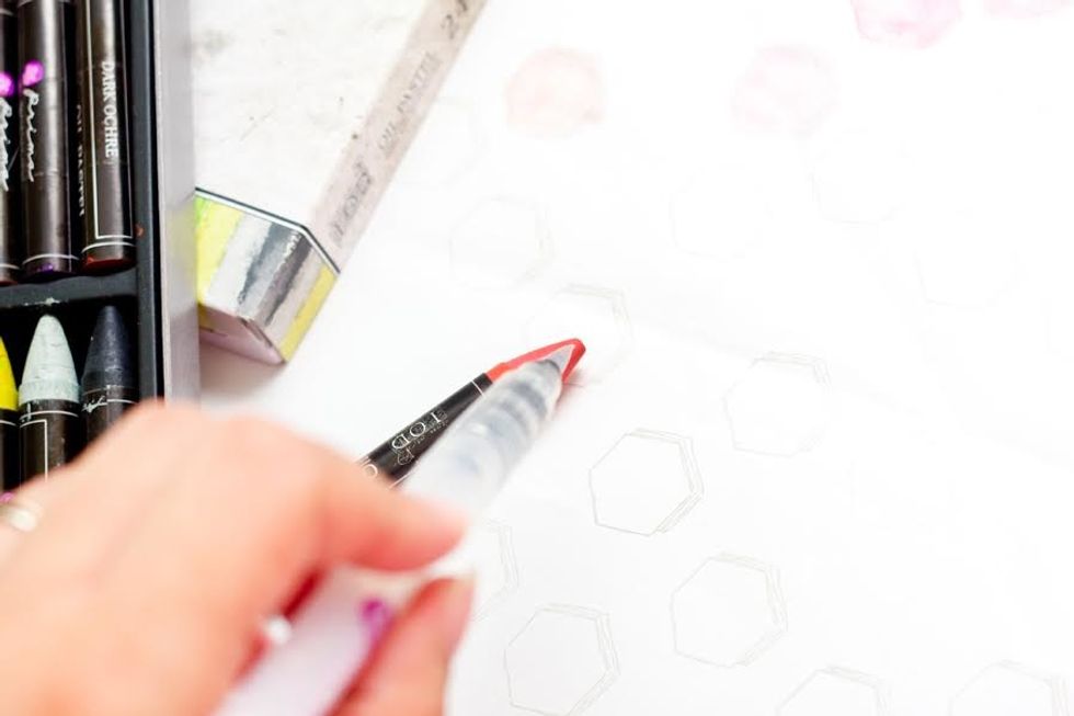 Use a water-colour brush pen and touch directly to an oil-pastel to transfer color.