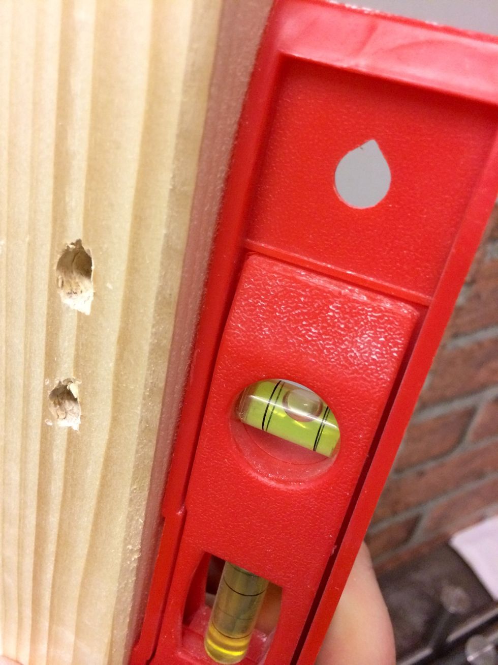 Use a water level to make sure the pole is straight.