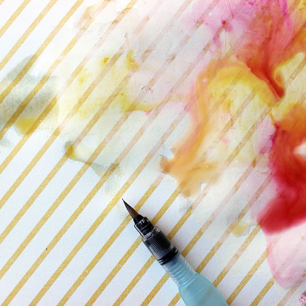 Use a waterbrush to spread the colors on top of the gesso first. Then working into the fully-colored areas. Notice how differently the colors react with the gesso. Dry using a heat tool.