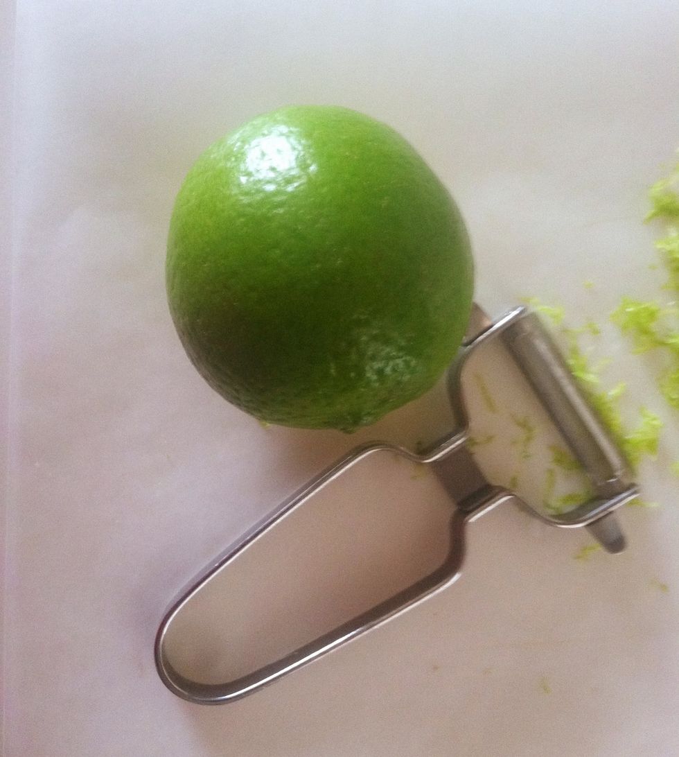 Use a wide potato peeler. . Pull against the lime to remove the peel.