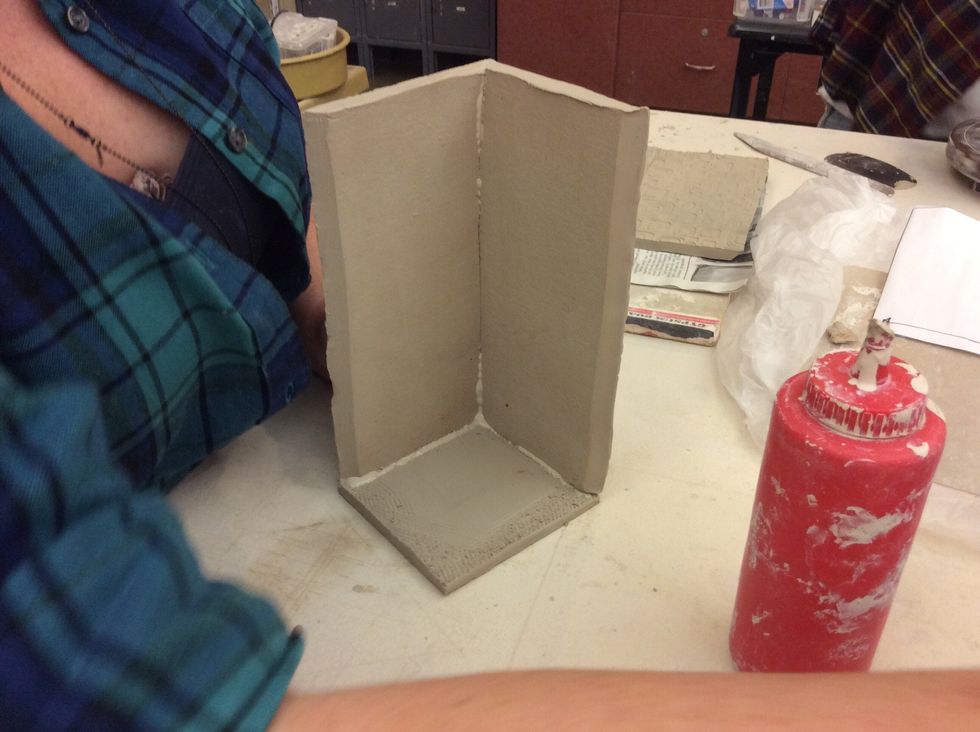 Use a wood tool to "stitch" the seams inside of the form and press thin dame snakes of clay into each seam. Smooth inside seams.