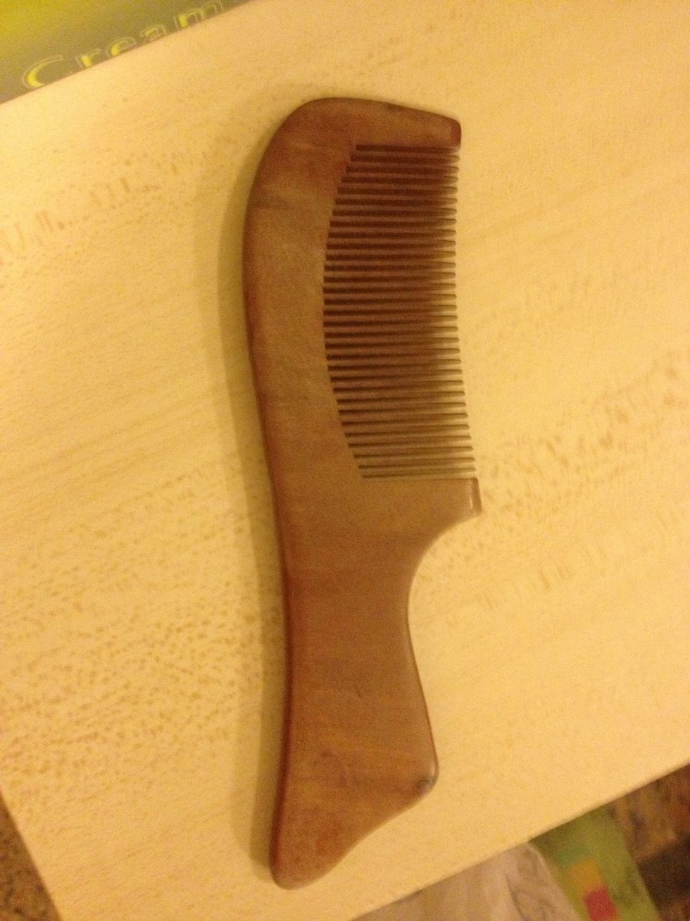 Use a wooden comb to comb your hair instead of a plastic comb. This will prevent you from creating static electricity, which will make your hair fly-away!