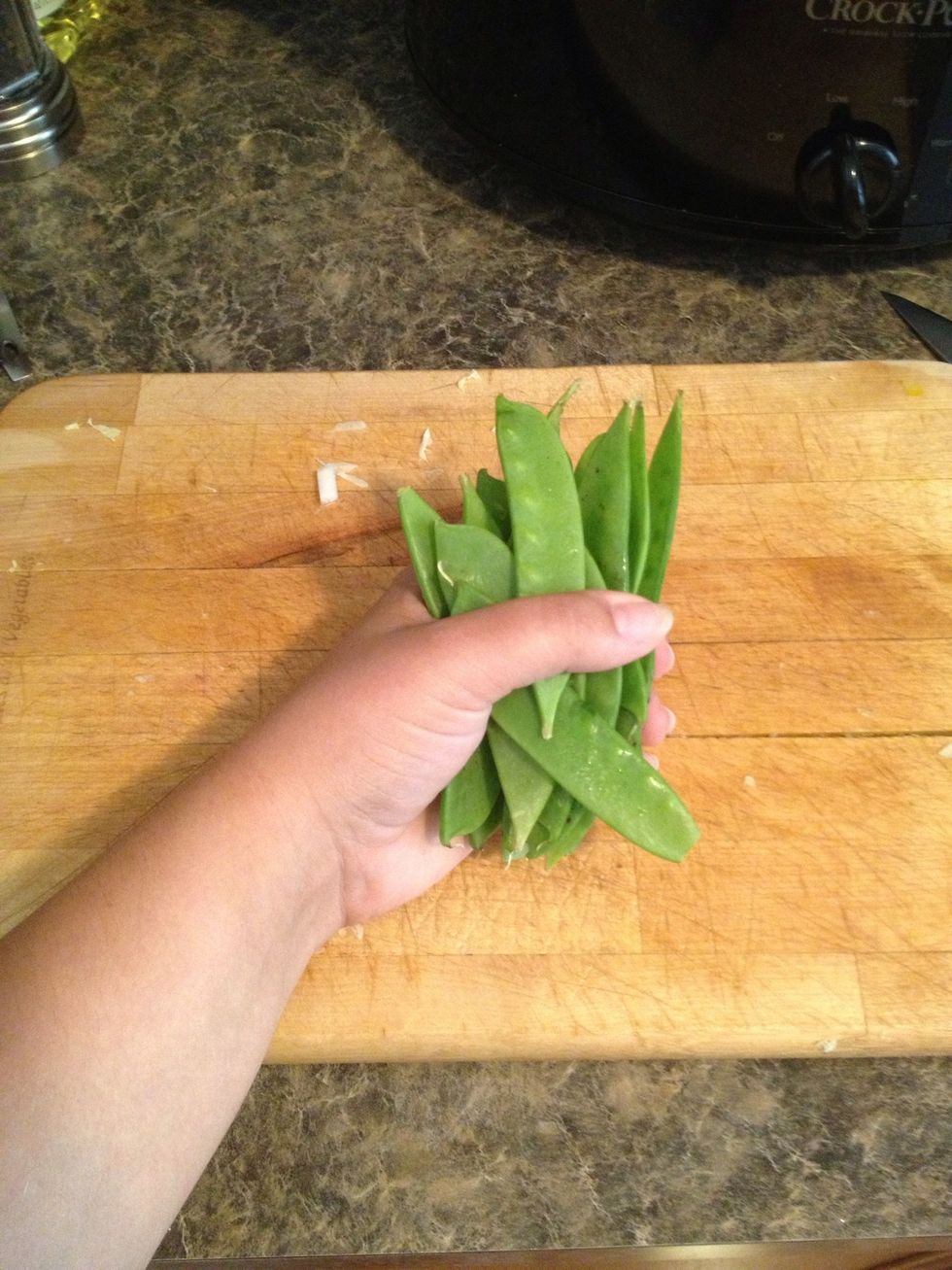 Use about a 1/2 cup of snow peas or a small handful.