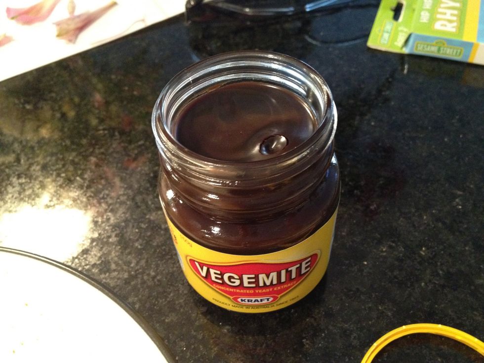 Use all your strength to unscrew the lid, which has been excessively tightened to prevent children from accidentally opening and permanently ruining their appetites (and faith in humanity)