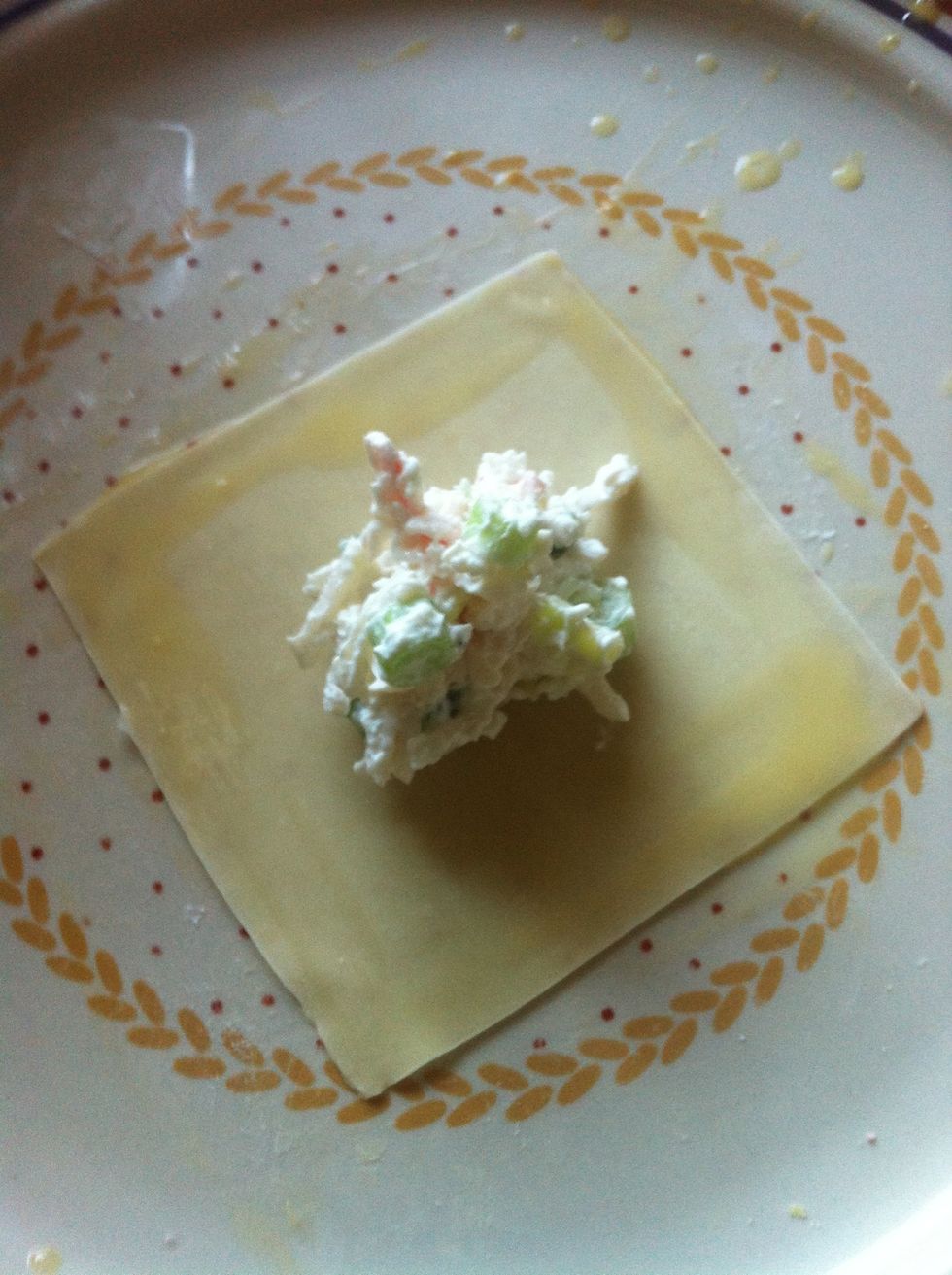 use an egg wash and wet all 4 sides of the wrap. (just beat an egg and add a little water for the egg wash) try not to be too messy on this part or everything will be all slippery and gross.