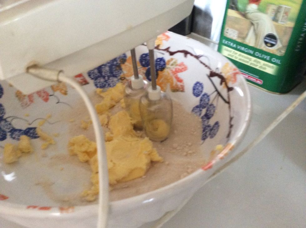 Use an electric beater to beat the butter and caster sugar into a bowl until lite and fluffy