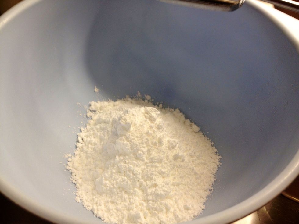 Use an electric beater to mix the egg yolks with icing sugar.