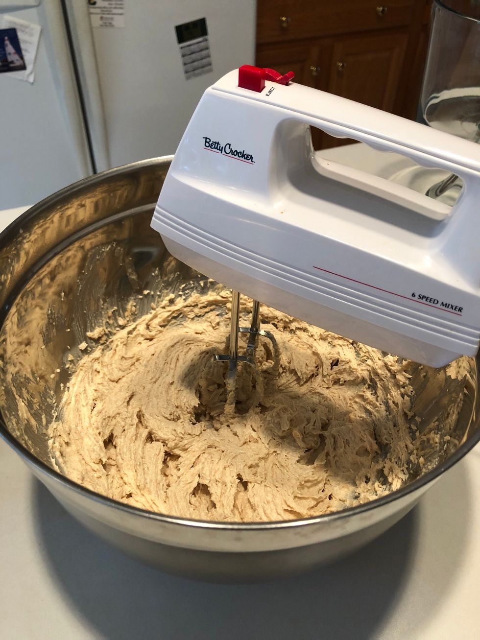 Use an electric mixer to beat mixture until light and fluffy.