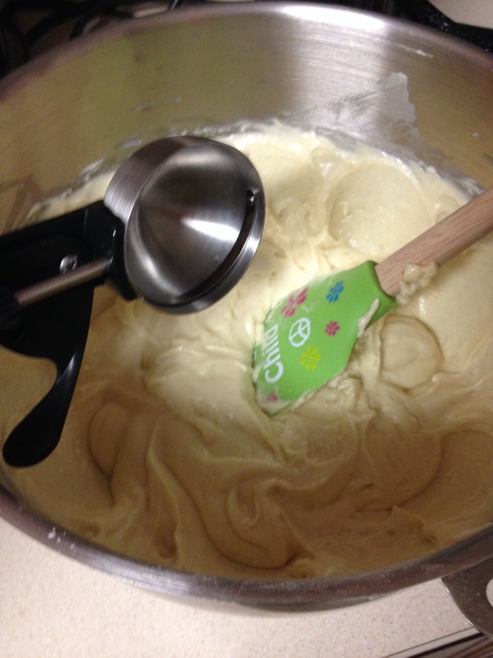 Use an ice cream scoop to ensure that there is an even amount of cake in each pan