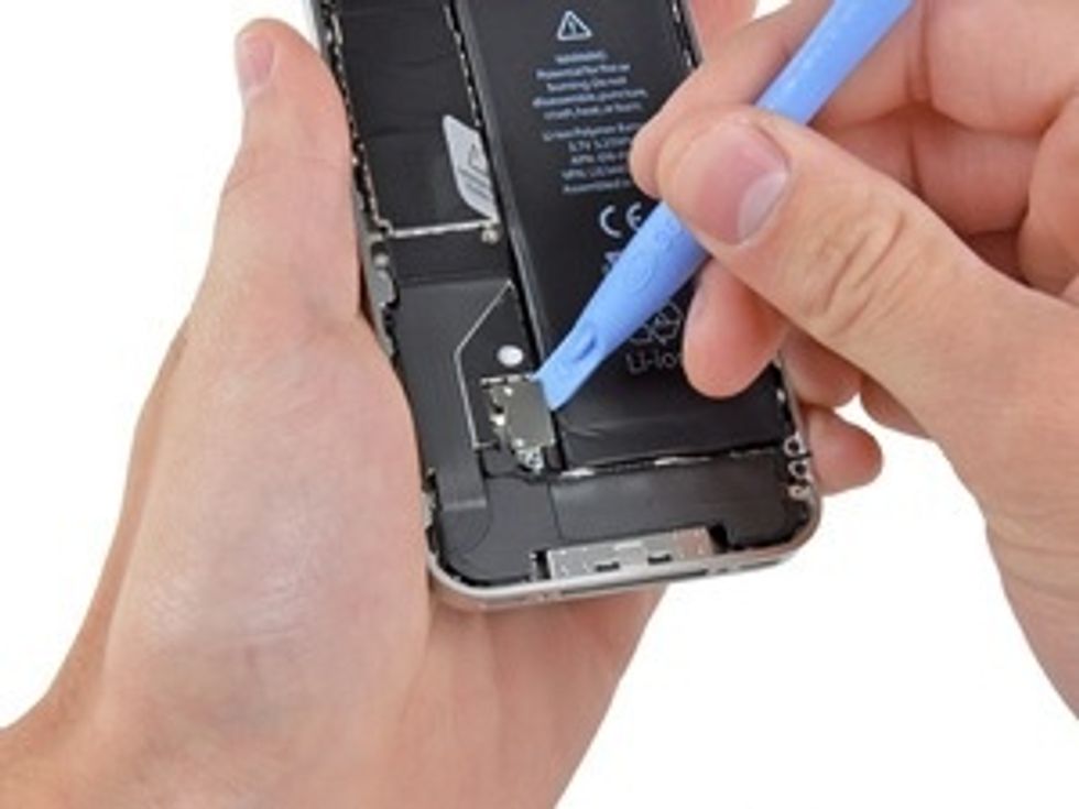 Use an iPod opening tool to carefully pry the battery connector up from the ends closest to the top and bottom edges of the iPhone. Remove the contact clip from the iPhone.