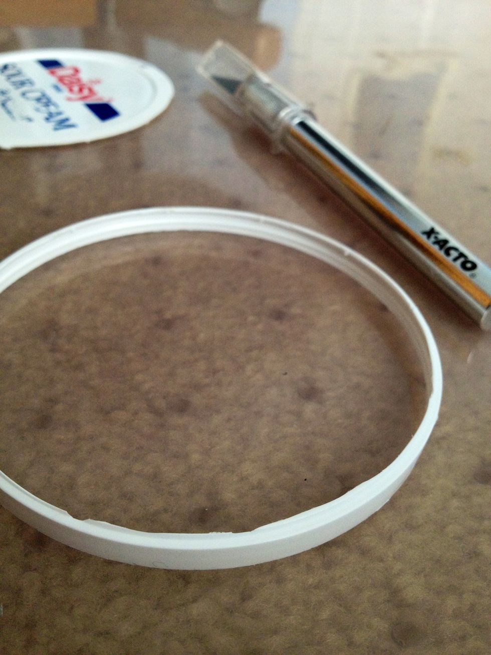 Use an X-acto knife to cut out the ring shape. Be careful while using it! If you are a child, ask an adult to do this for you.