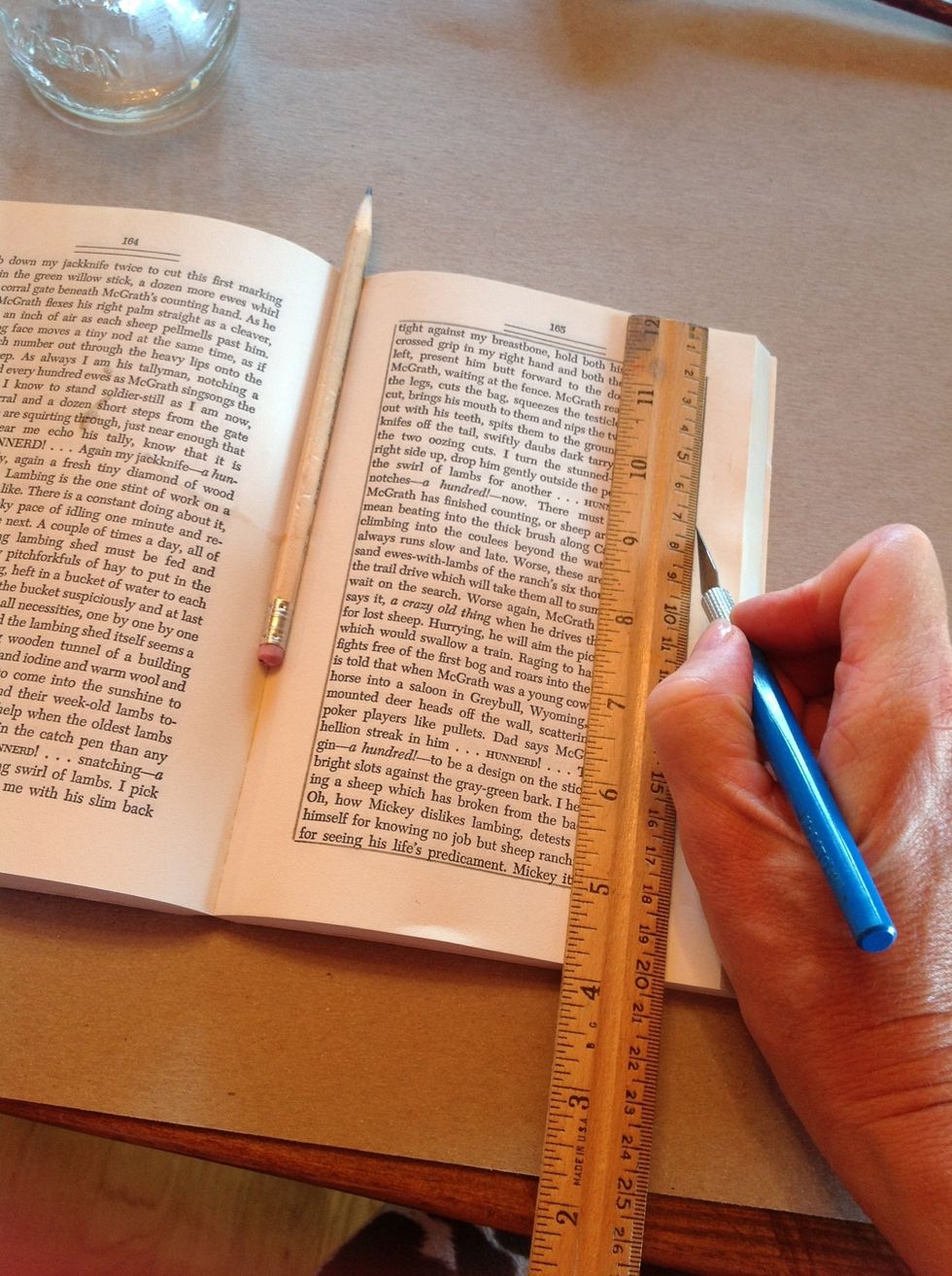 Use an x-acto knife to cut three to four pages out at a time. A ruler will help guide a straight line.
