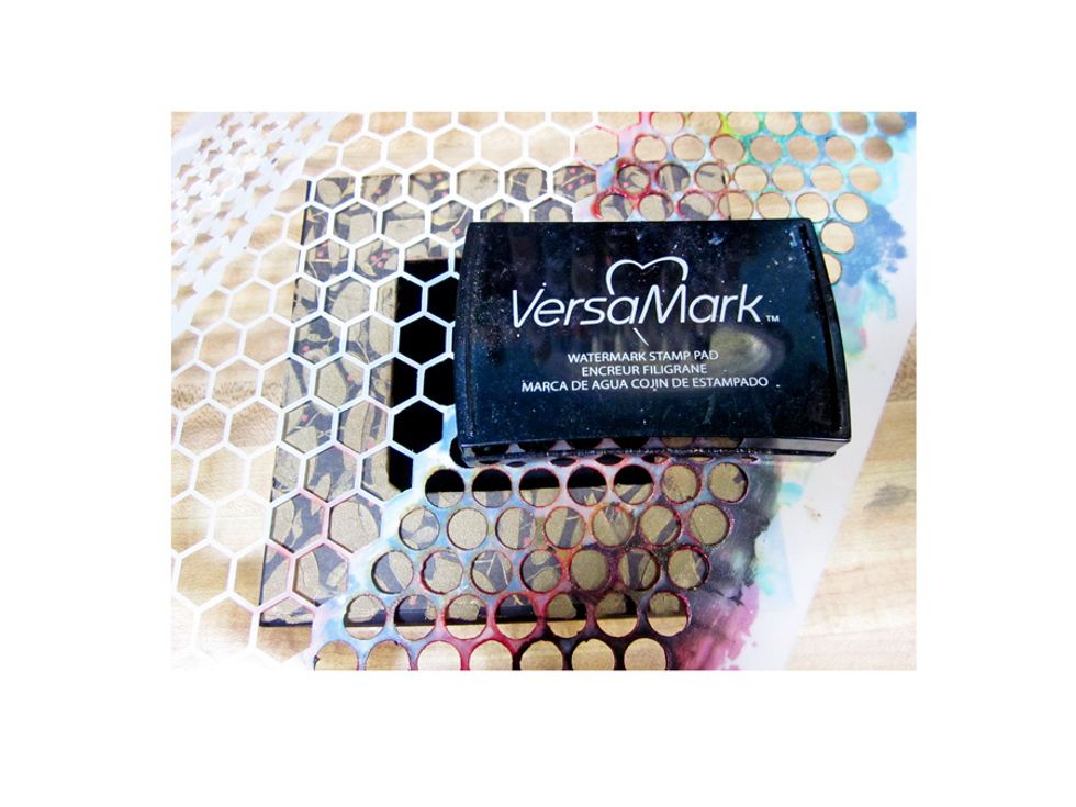 Use another stencial and apply clear Versa Mark ink in spots.
