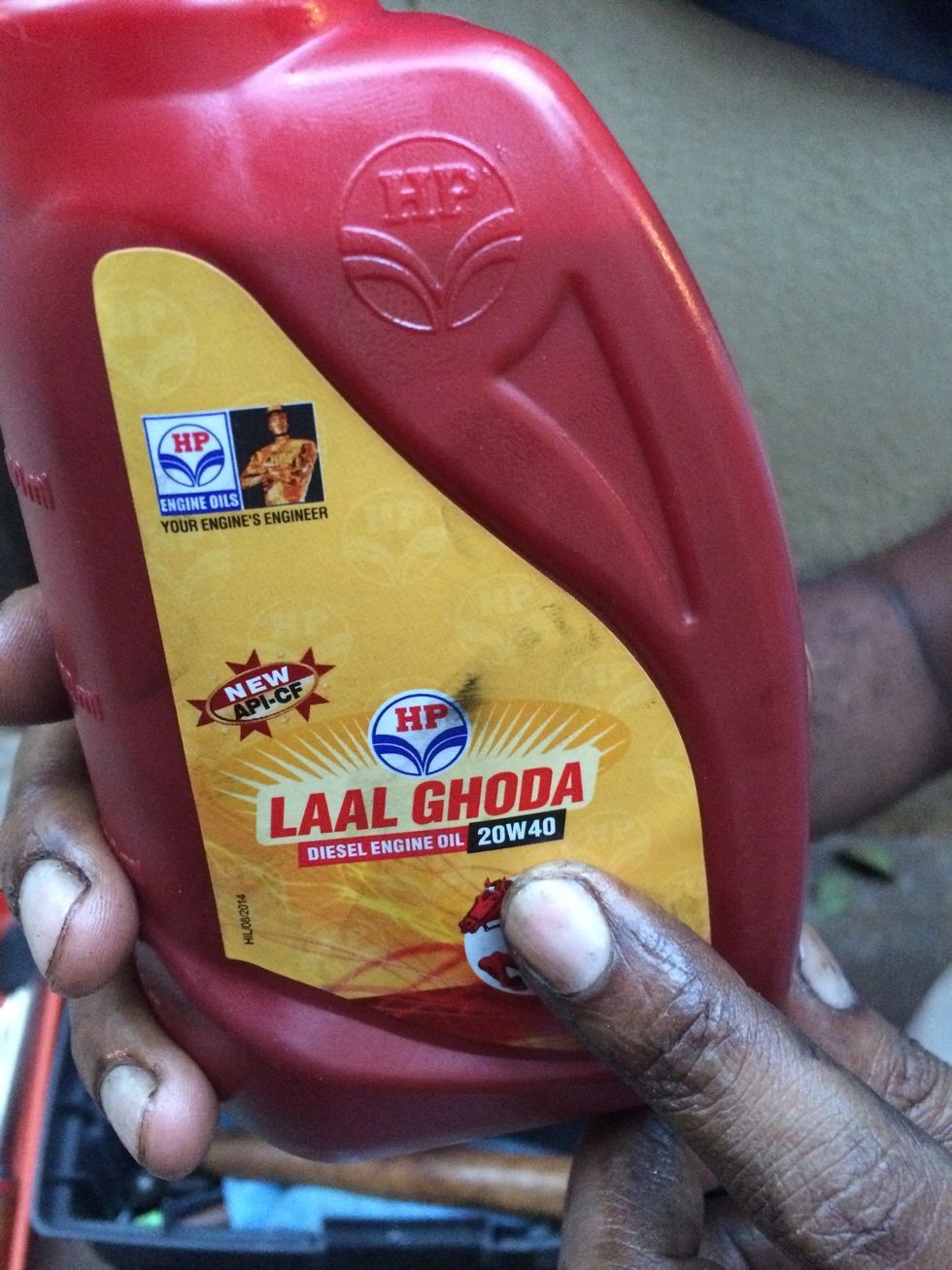 Use any brand 20W40 oil for refilling the primary case to set level