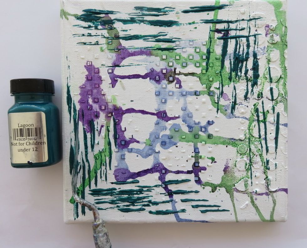 Use Art Anthology Lagoon Velvet paint and your pallet knife side to add lines with dimensional paint over the canvas edges as shown.