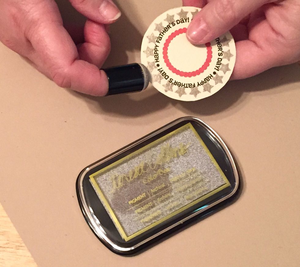 use Art Dauber and Platinum Silver Ink to distress the edges of both circle pieces and the card front.