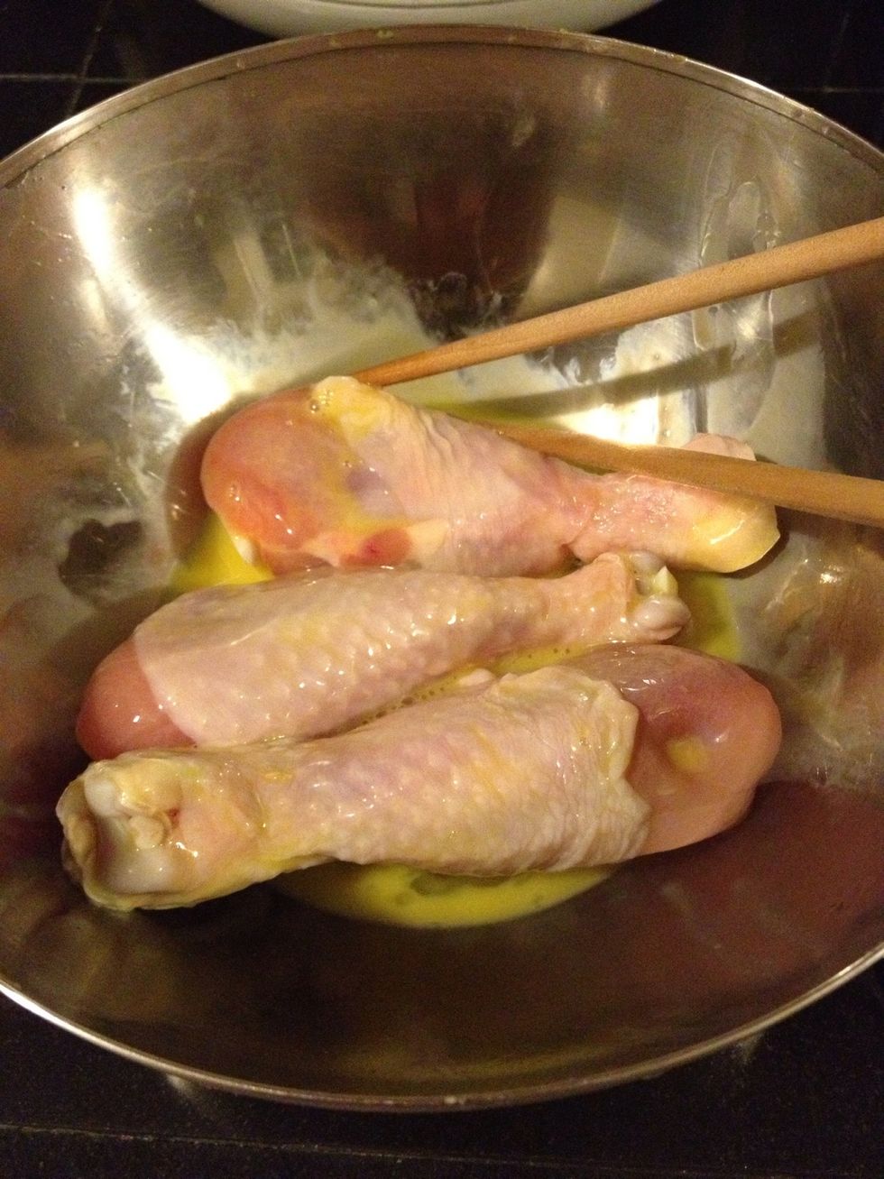 Use beaten eggs mixed with chicken drumstick.