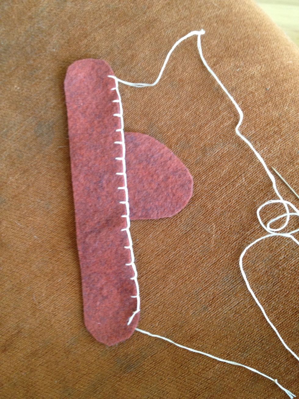 Use blanket stitch to embroider the top of the slipper.