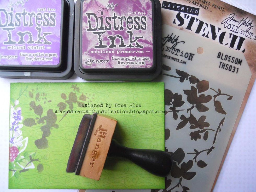 Use blending tool with Distress Inks (Seedless Preserves and Wilted Violet) to mask some blossoms with the back of the Tim Holtz (Blossom) Stencil.
