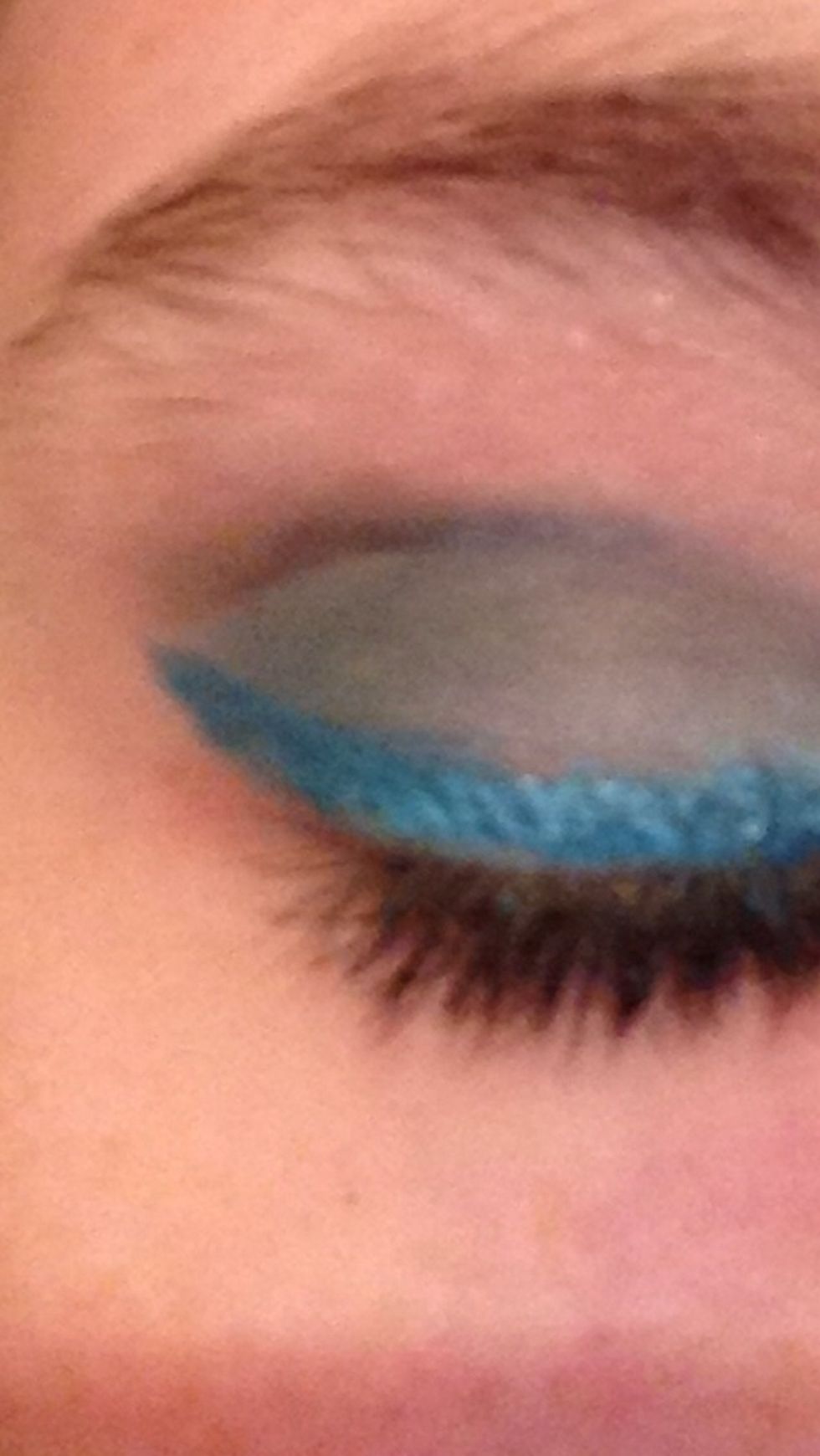 Use blue eyeliner and make a flick.