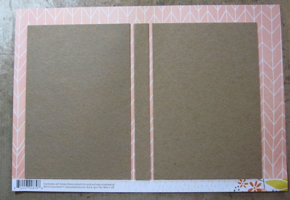 Use bone folder to crease the top, bottom & sides. You can wet the edges of the paper with a barely damp paper towel to prevent the paper from cracking. Go ahead and fold along either side of spine.