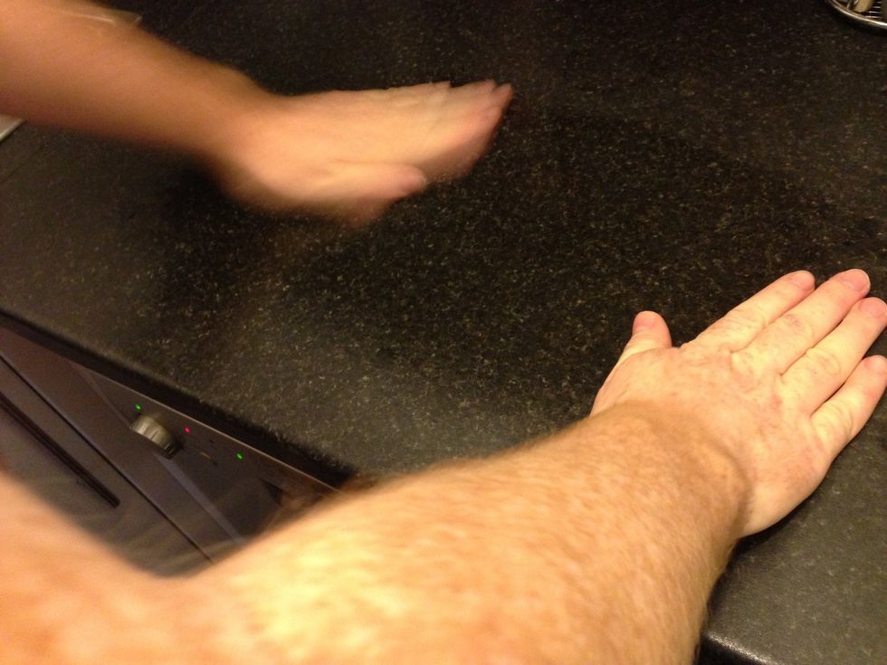 Use both hands to spread the oil over the surface. A coating of oil on the hands makes it easier to handle the dough.