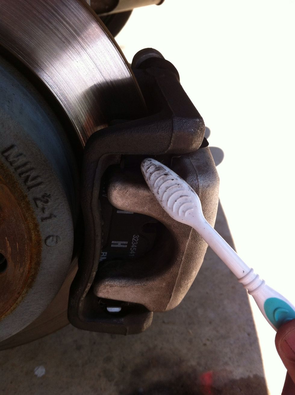 Use brake cleaner and toothbrush to clean off all the brake dust.