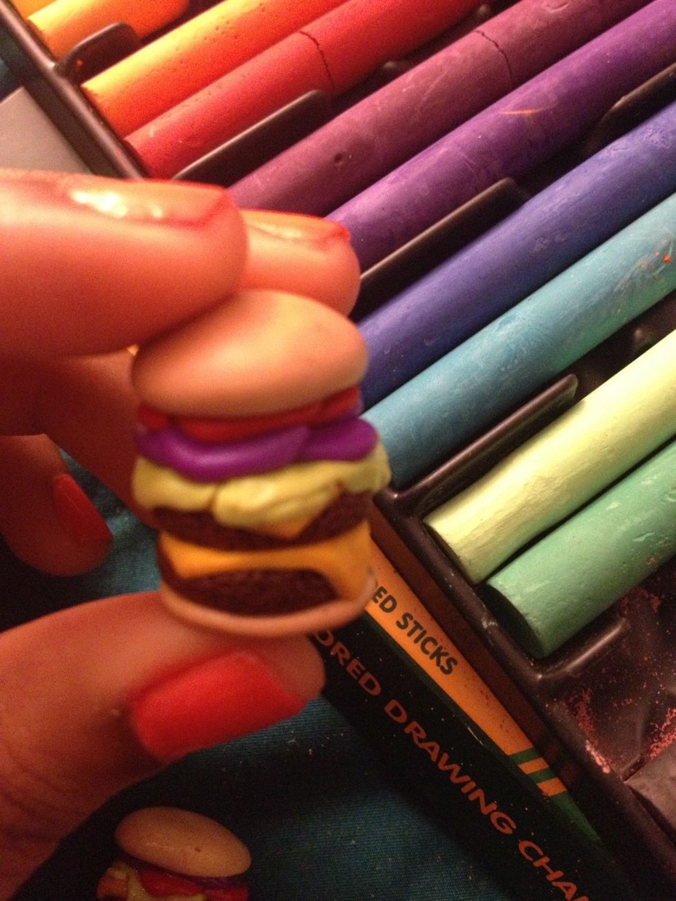 Use brown chalk to color the buns and black chalk to color the burger so it looks grilled and more realistic.