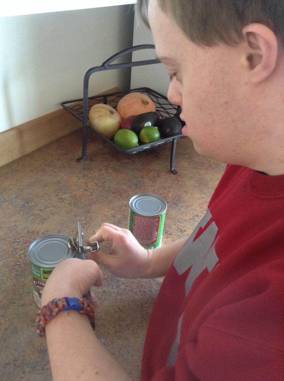 Use can opener to open can of coconut milk. The next slide is an example of how to use the can opener