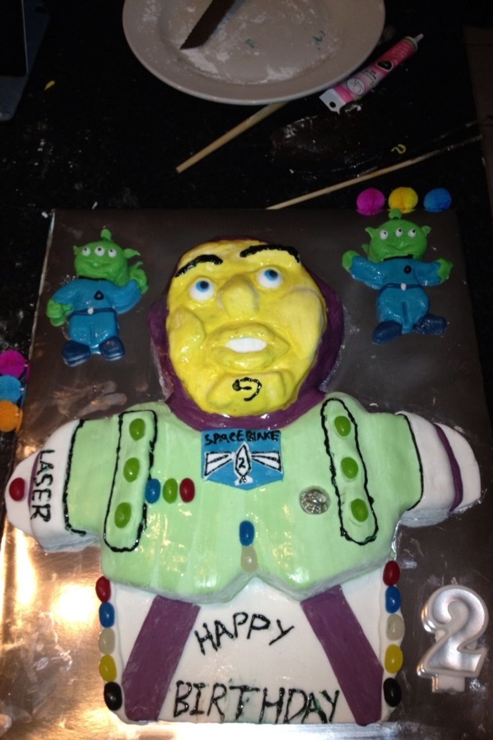 Use Candies to Decorate the cake remembering dos not have to be Perfect kids love it just the way it is