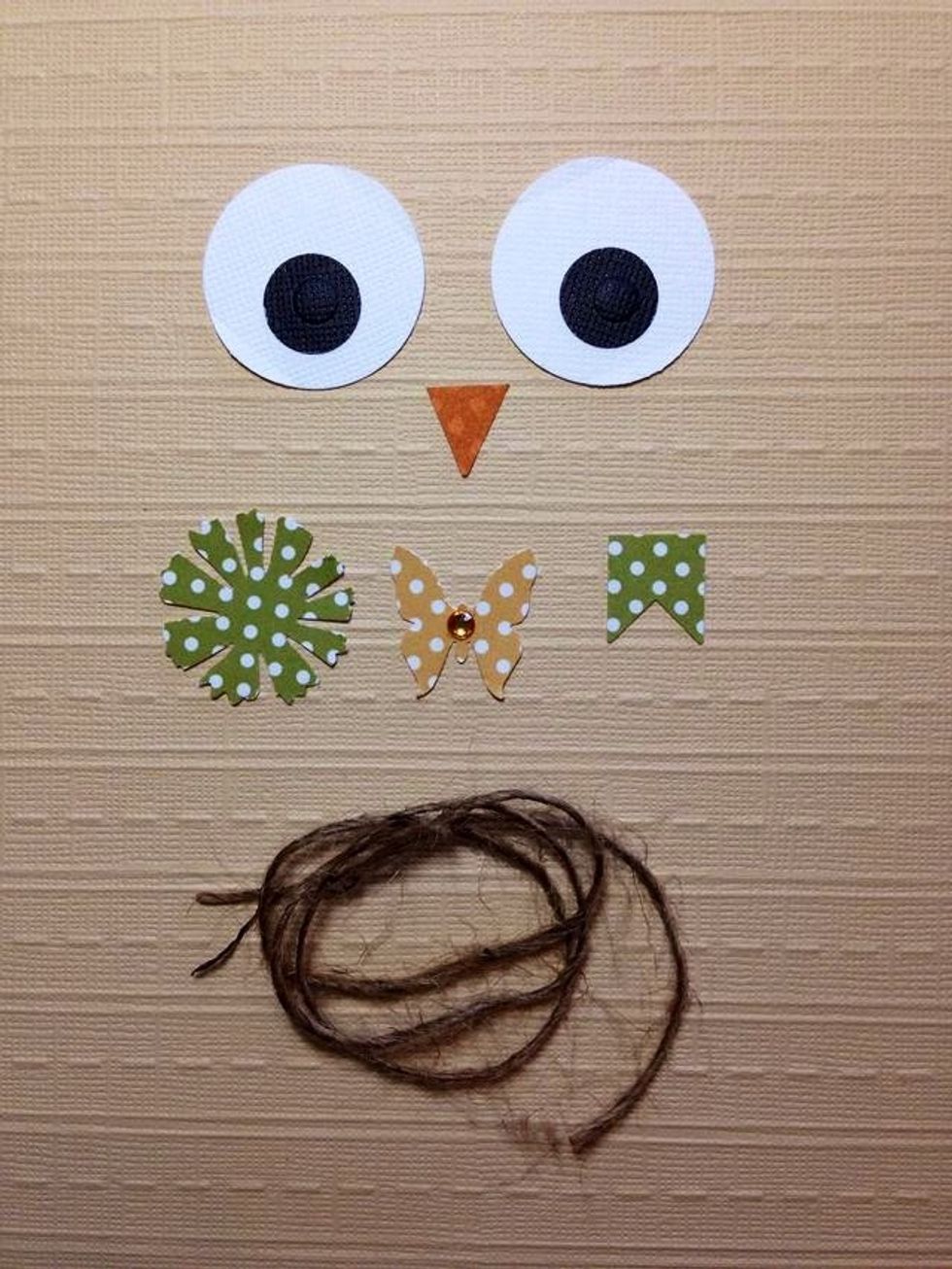 Use circle punches or trace circles for the eyes. Use any small embellishments you have or punch a flower, a butterfly and a little tag. You will use a piece of twine on the final step.