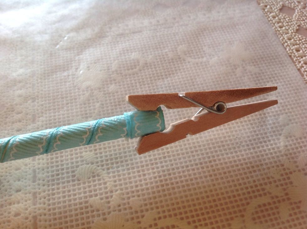 Use clothes pin to hold until dry. Do this on both ends of dowel.