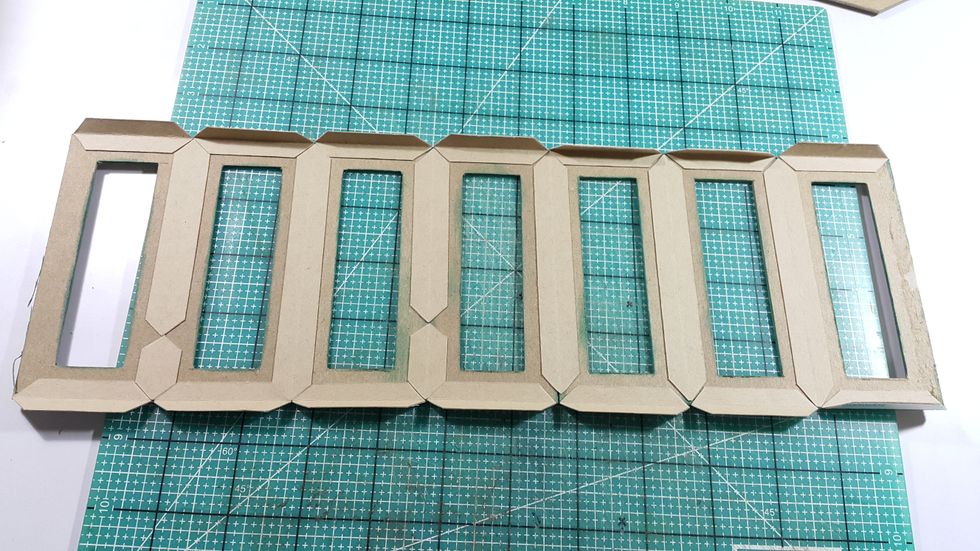 Use connecting strips to connect 7 of the panels, and adhere also on the top and bottom, left one panel for future steps.
