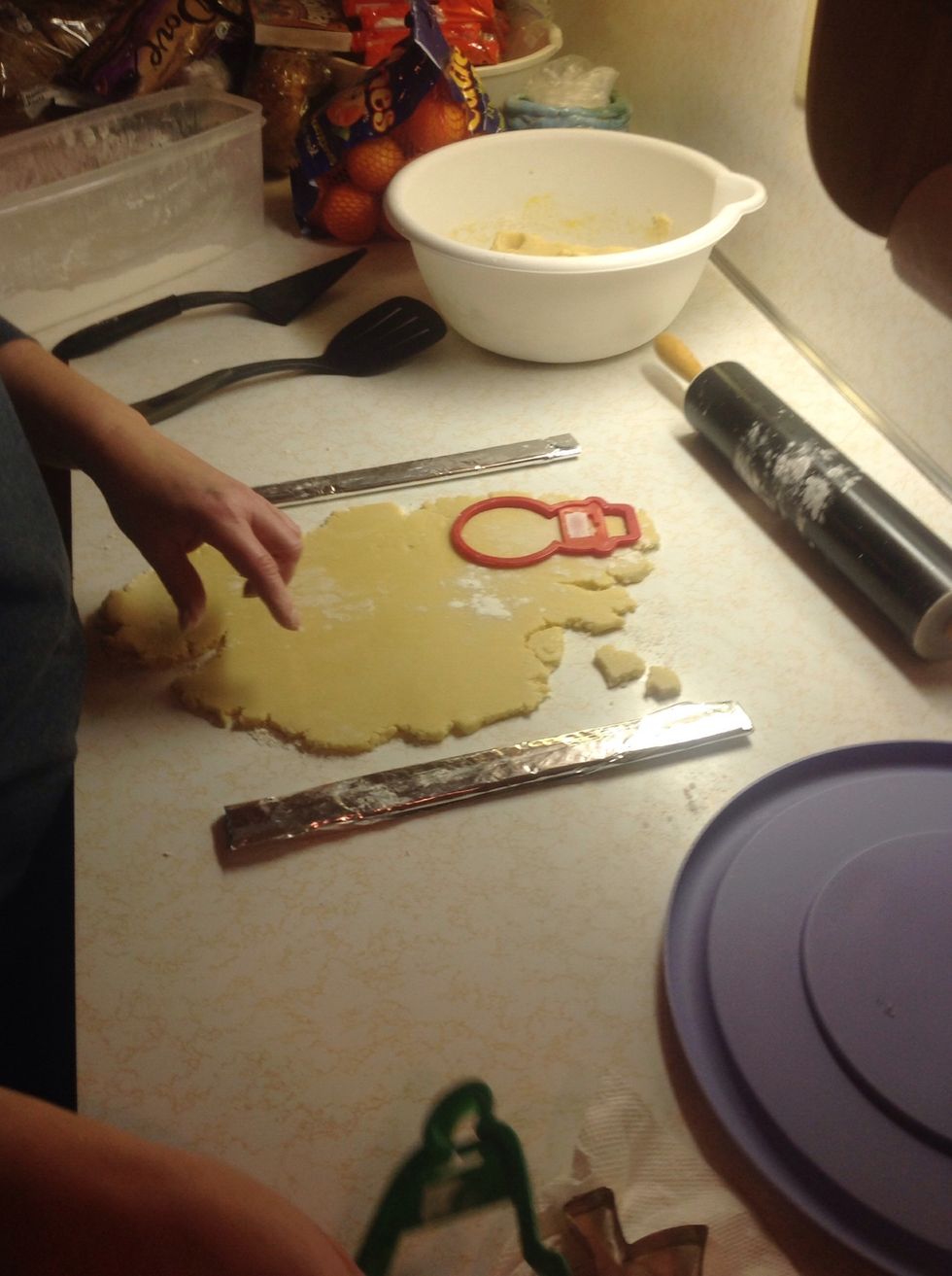 Use cookie cutters to cut out shapes in the dough.