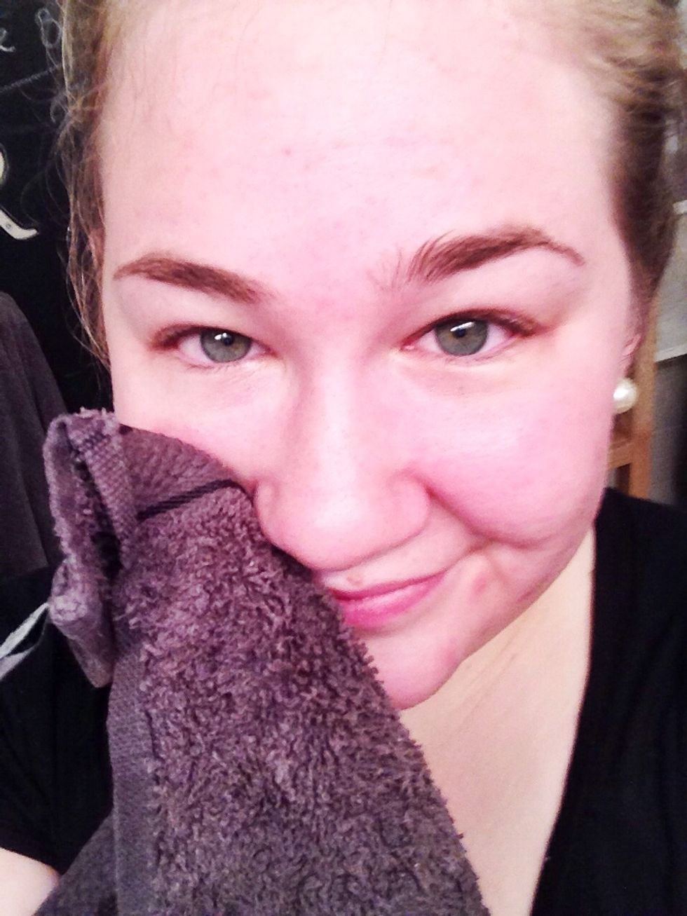 Use corners of washcloth to remove any excess oil, leaving a thin layer of oil on face. The redness will subside quickly. Yay for having clean pores!
