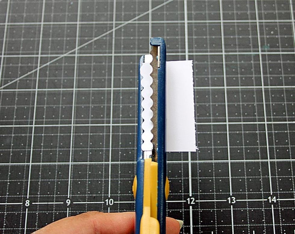 Use decorative scissors to cut a thin, scalloped strip.